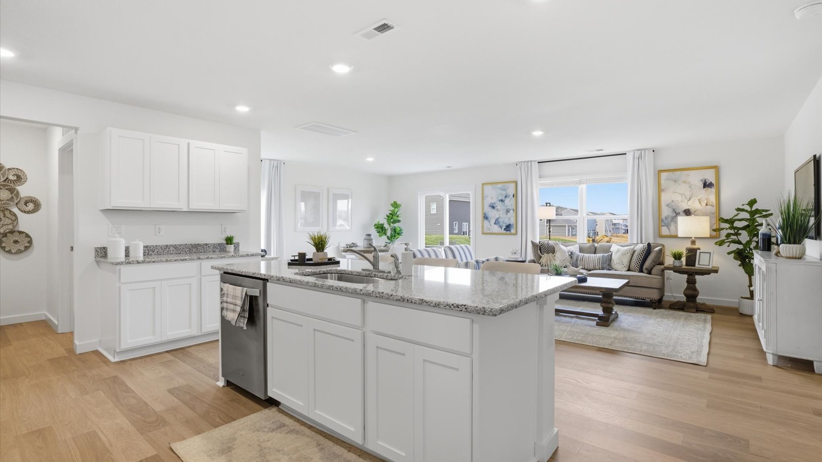 Open concept living, dining, and kitchen space