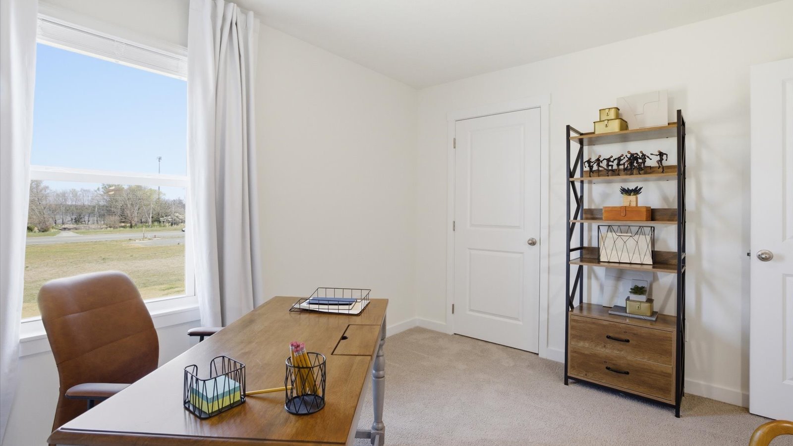 Bedroom with ample natural light and carpet floors