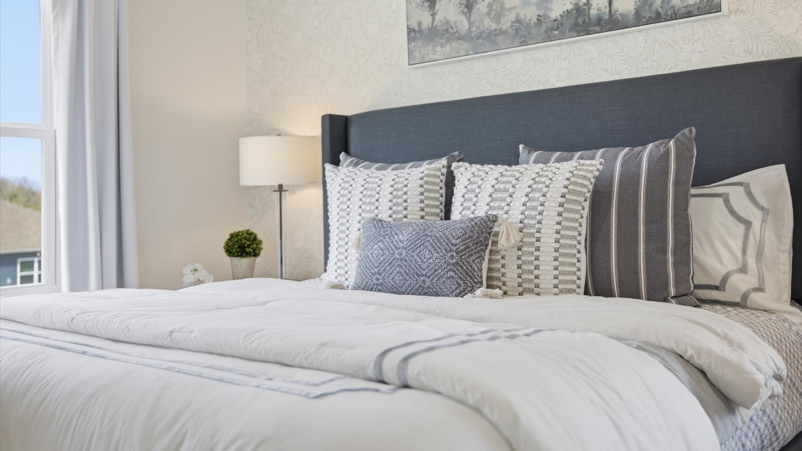 main level Primary bedroom with private attached bathroom and walk-in closet