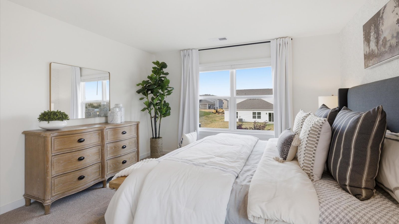 main level Primary bedroom with private attached bathroom and walk-in closet