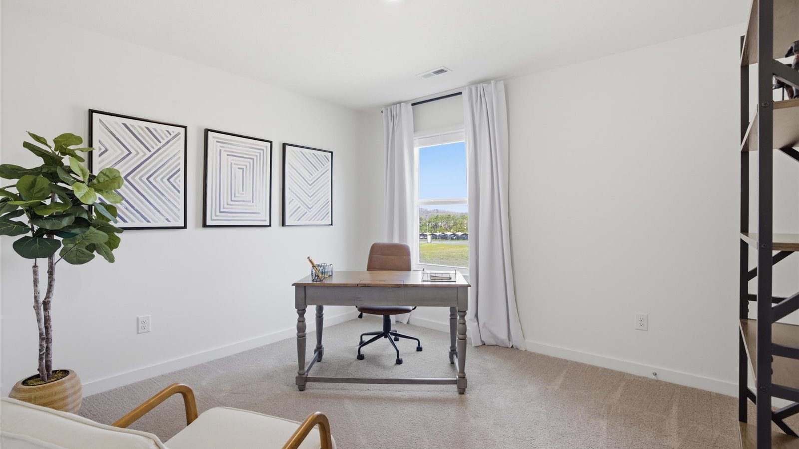 second bedroom staged as an office