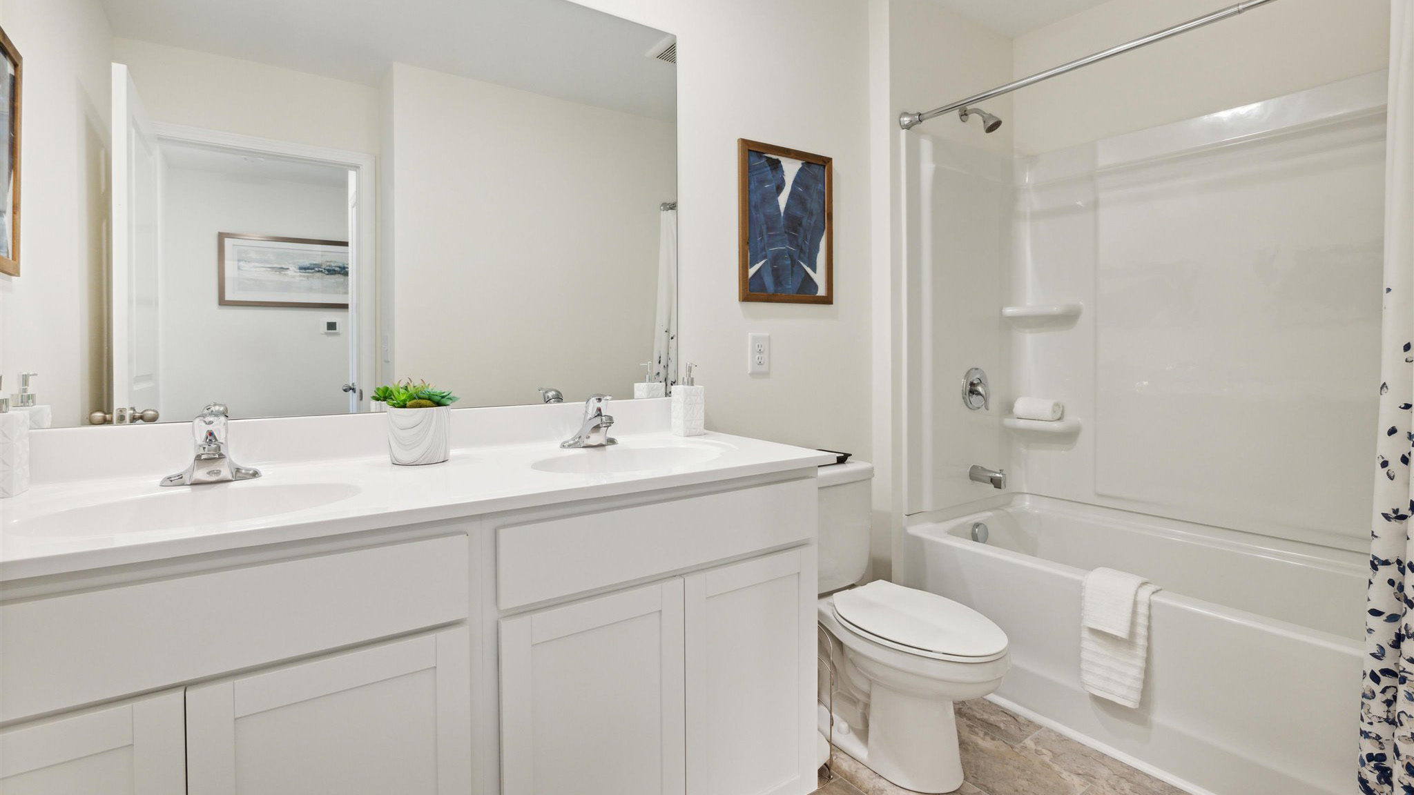 Upstairs bathroom with combination shower and bathtub