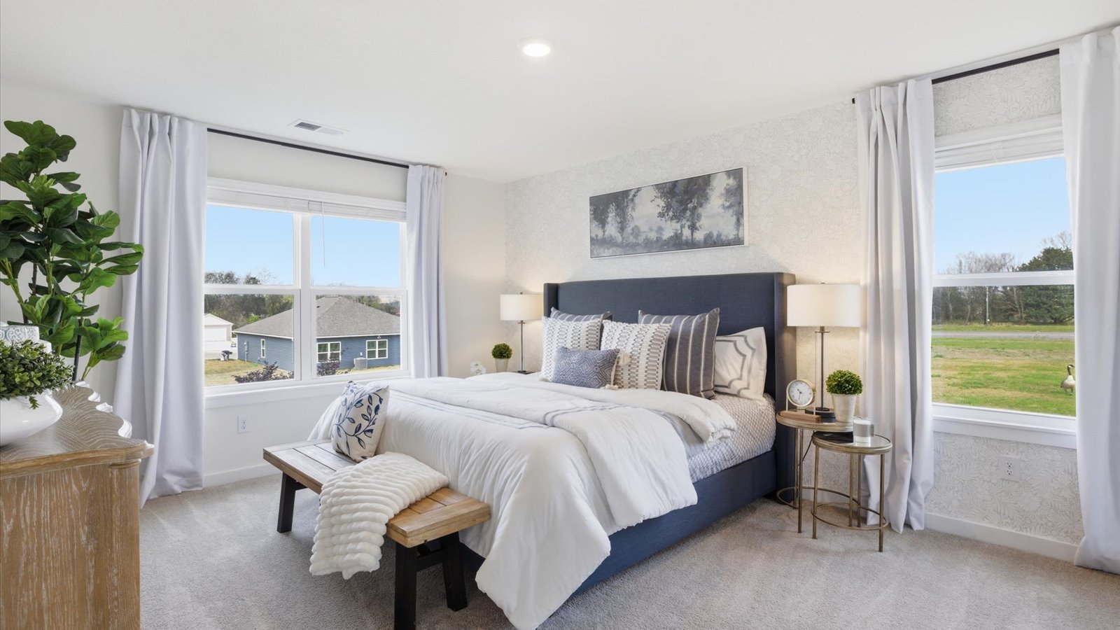 main level Primary bedroom with private attached bathroom and walk-in closet