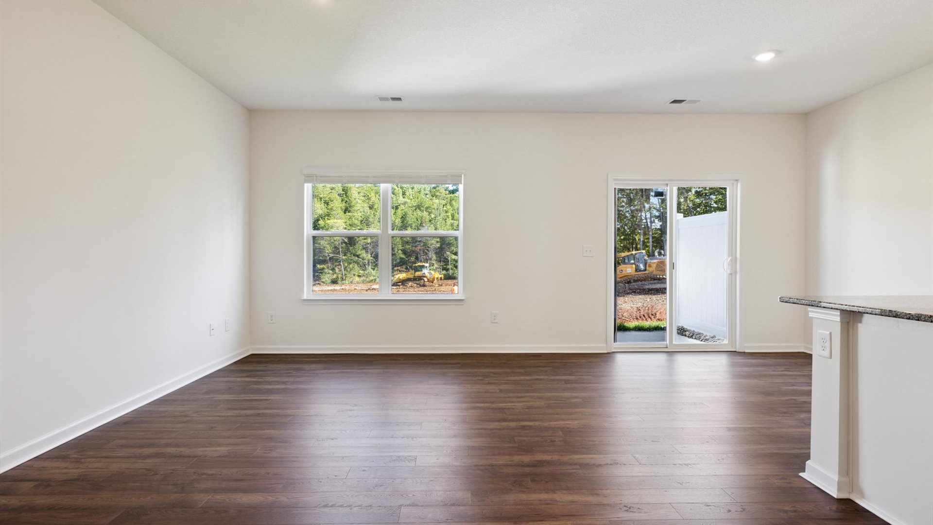 View from kitchen into the dining and living areas, backyard area, showing fresh open design at Cherokee Crossing