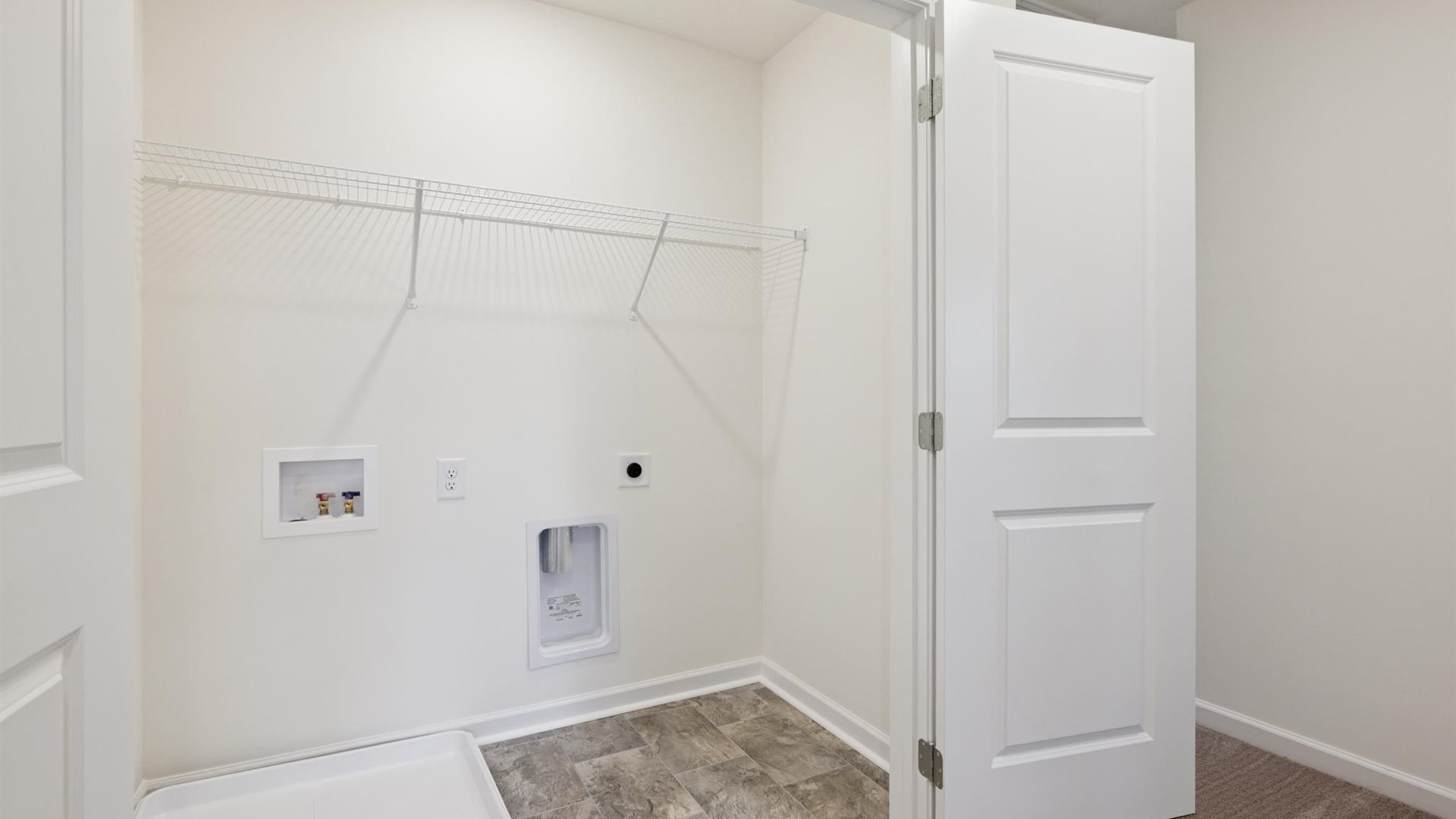 Cherokee Crossing utility laundry smartly designed with overhead organized storage, a drop zone, with new washer, dryer included