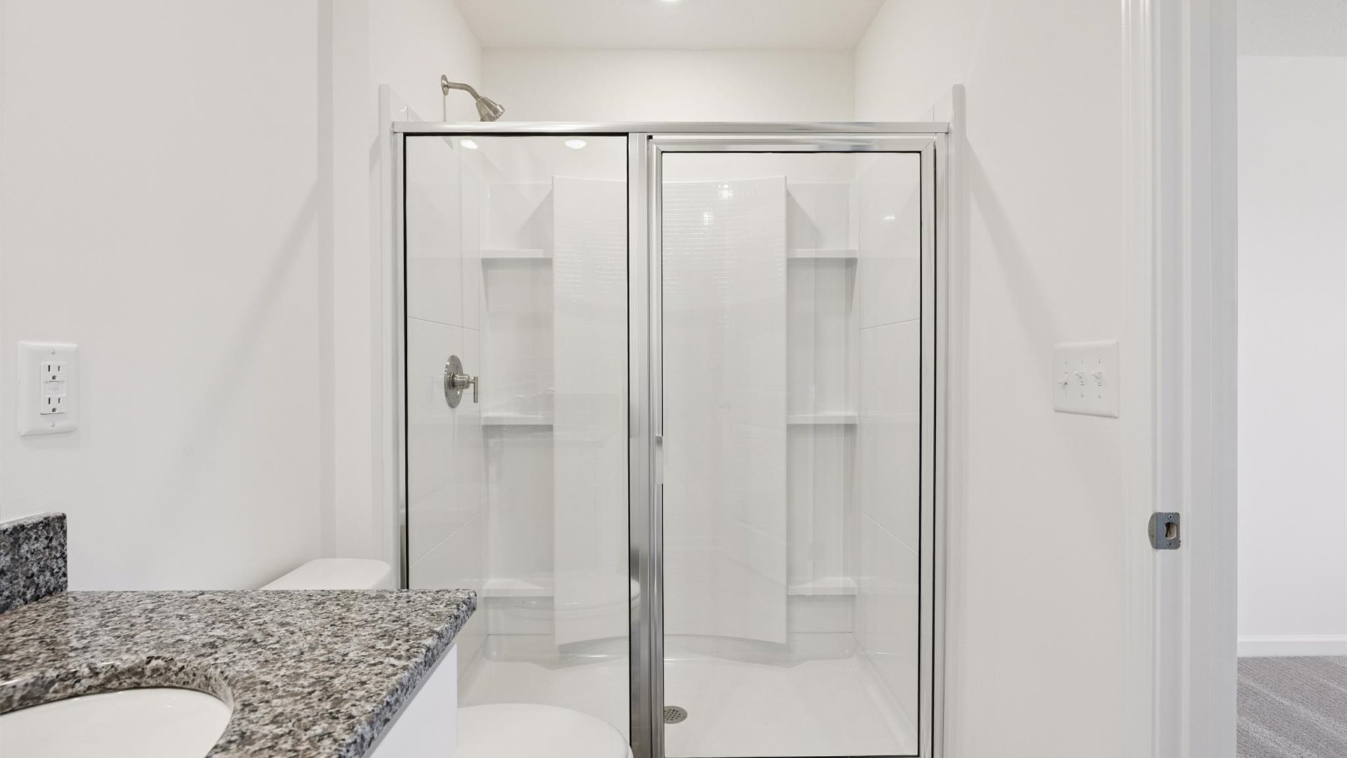 Owner’s ensuite in a D.R. Horton new build home offers function and style with a walk-in closet, spa-like ensuite