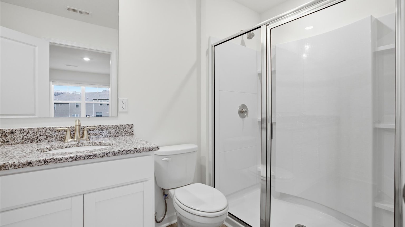 Private attached primary bathroom with built in vanity