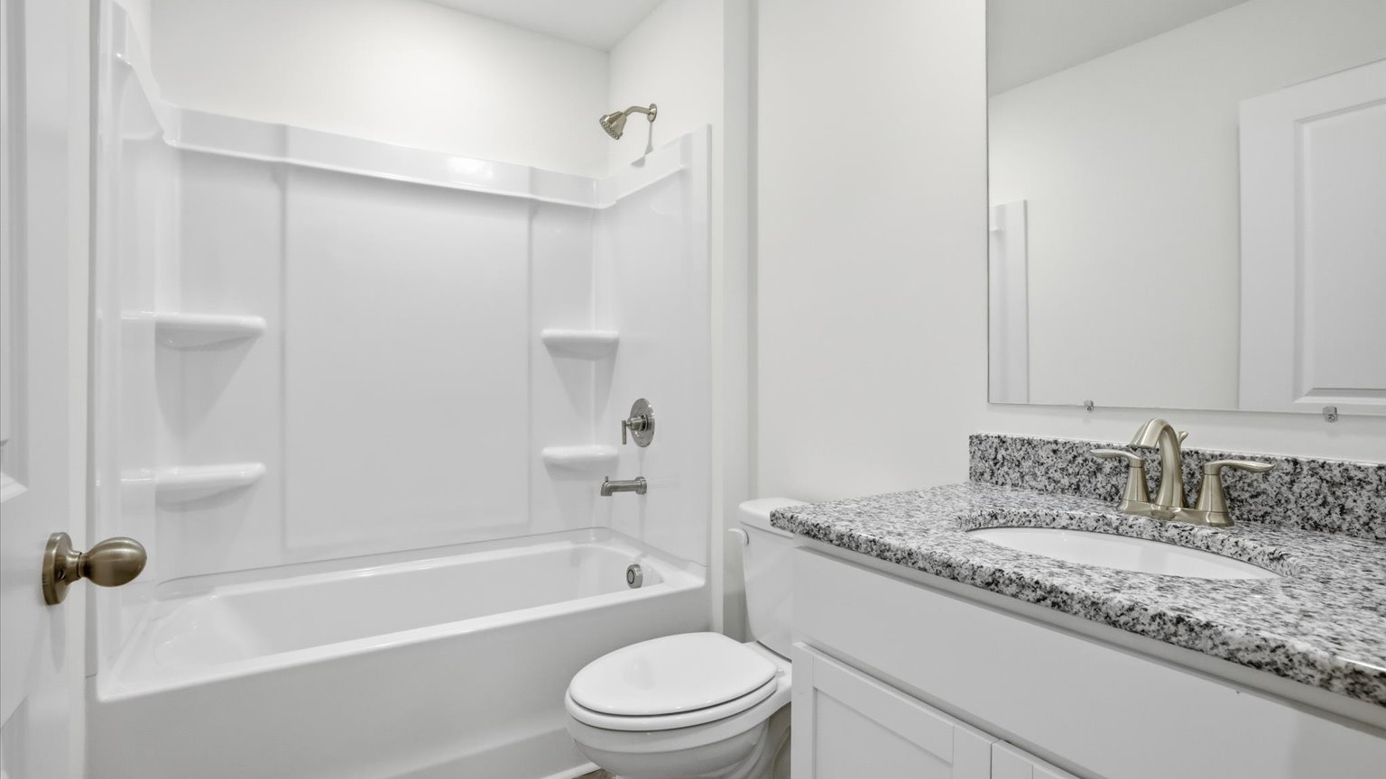 Guest bathroom with built in vanity and combination bathtub shower