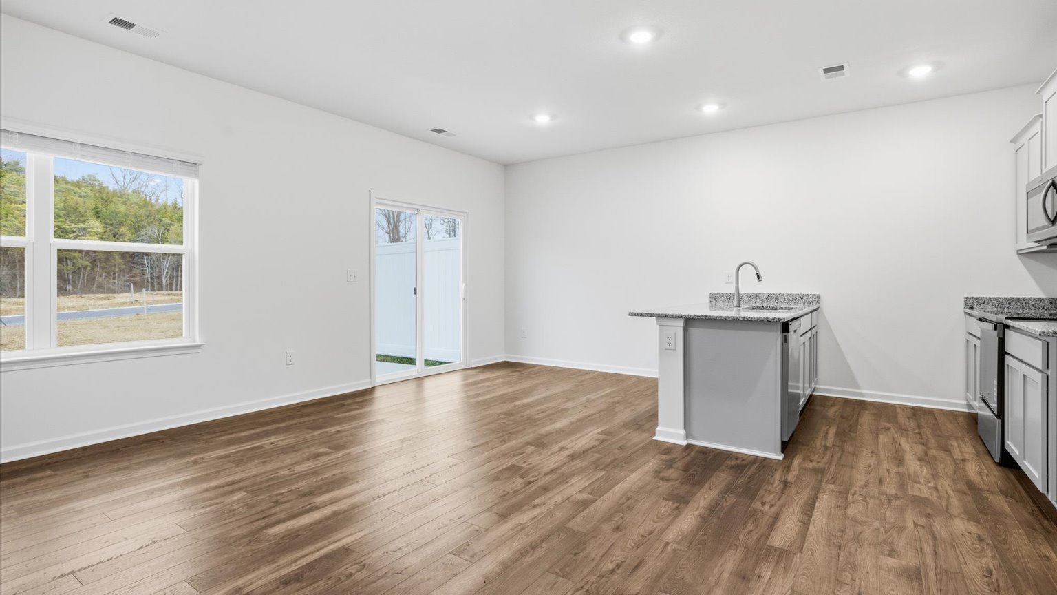 Open living and great room area with ample natural light