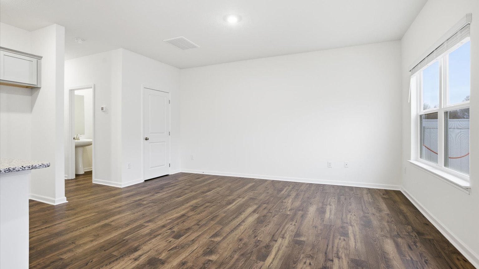 Open living and great room area with ample natural light