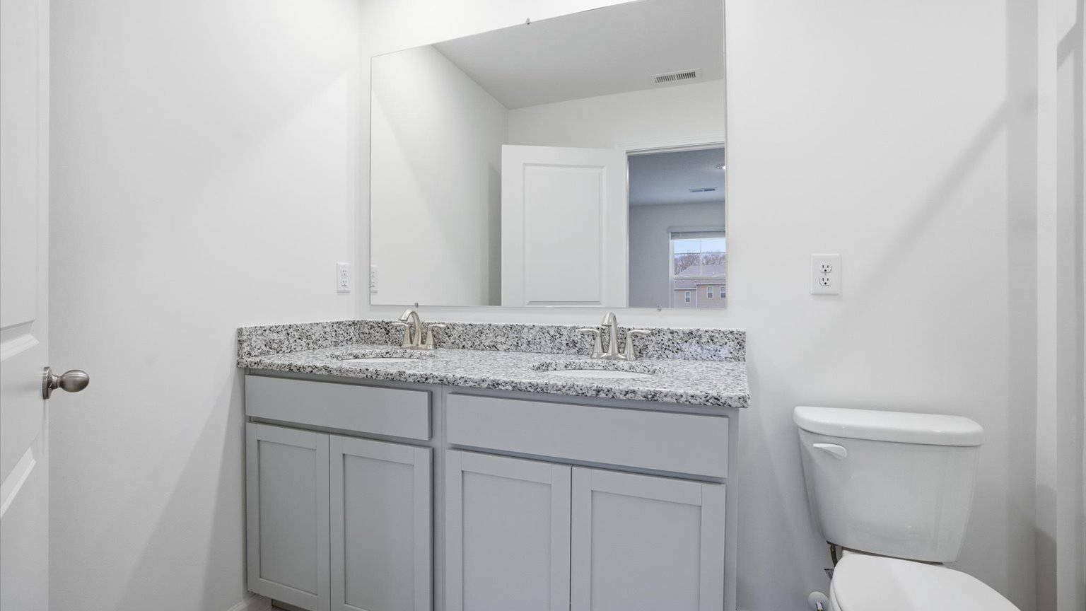 Private attached primary bathroom with built in vanity