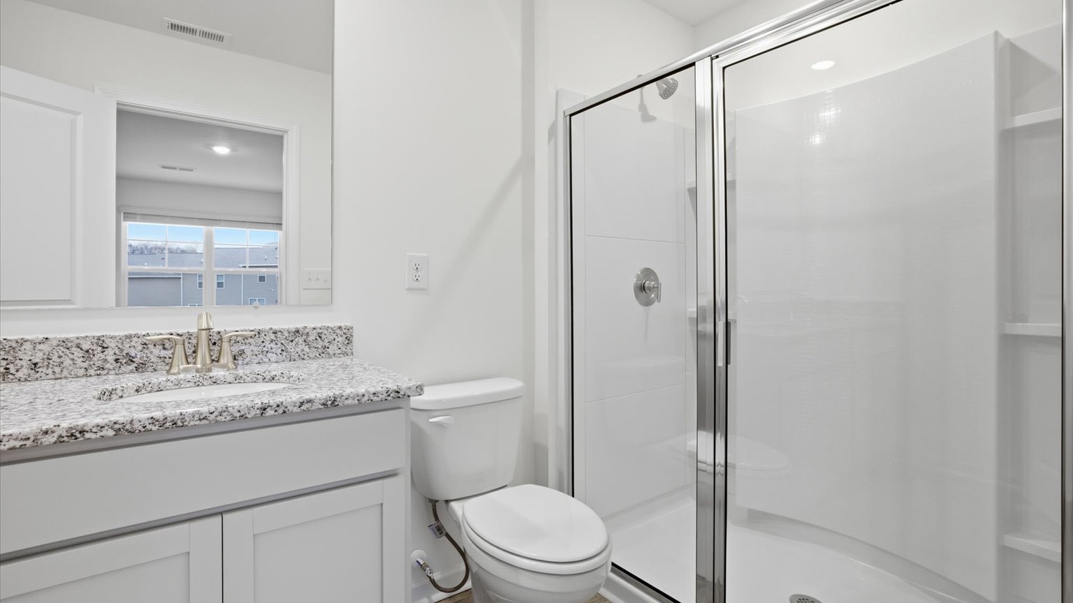 Private attached primary bathroom with built in vanity