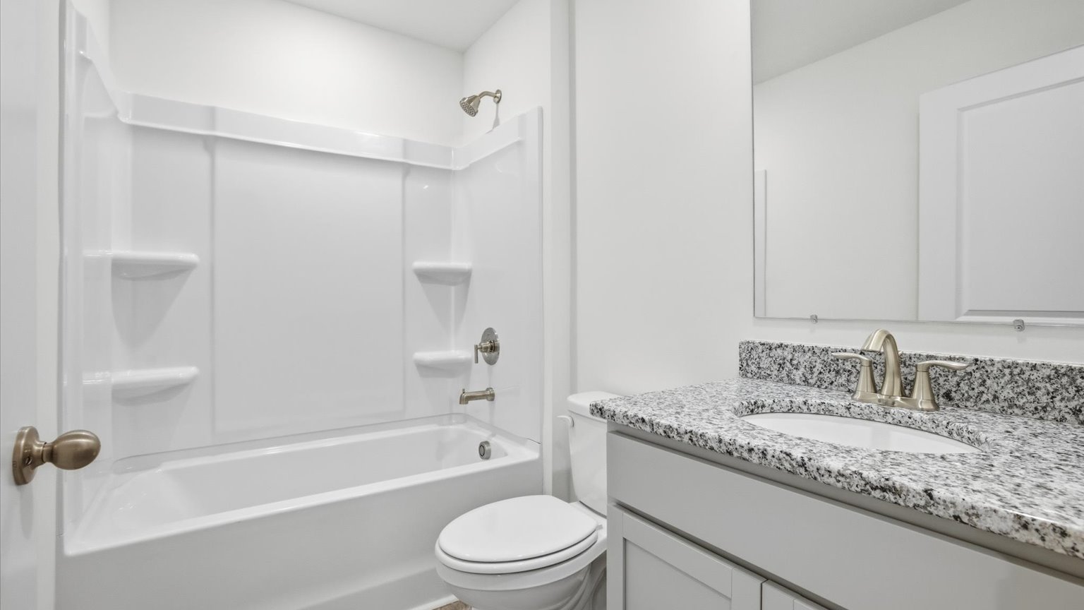 Guest bathroom with built in vanity and combination bathtub shower