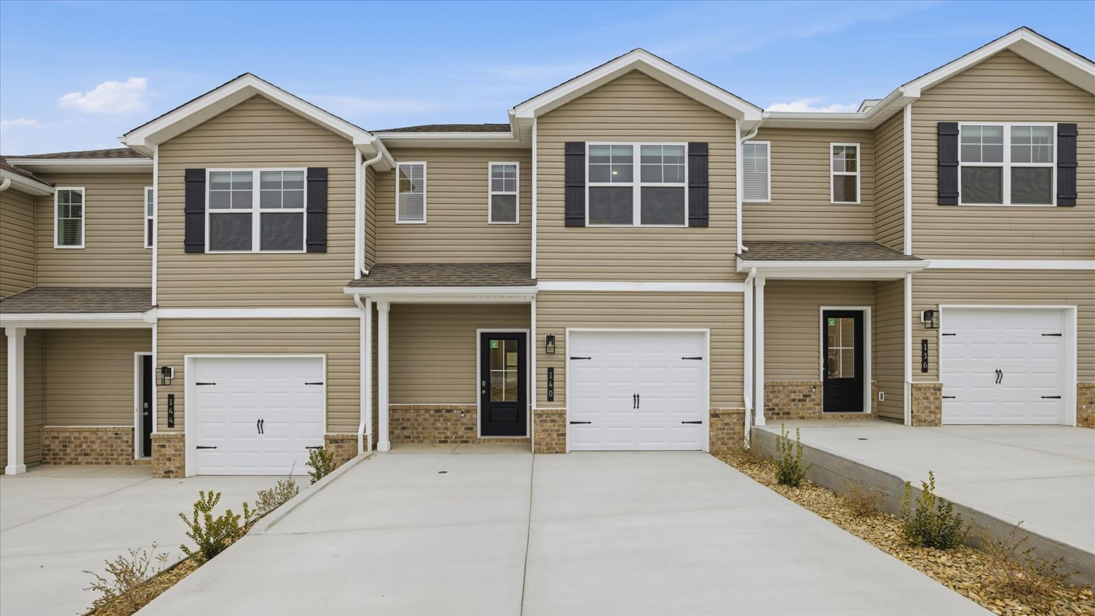 Front exterior of traditional two story townhome