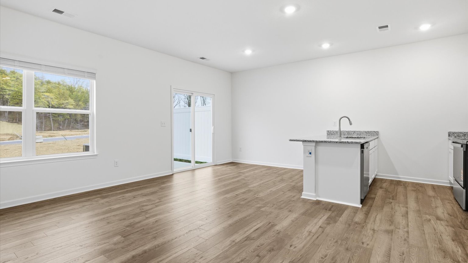 Open concept kitchen, living, and dining room space