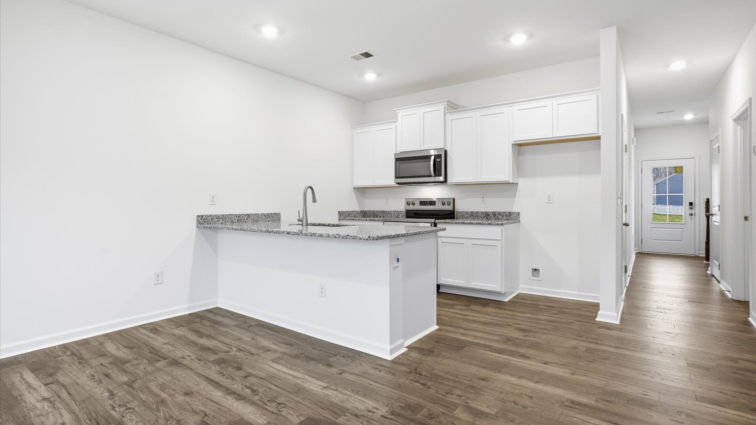 Open concept kitchen, living, and dining room space