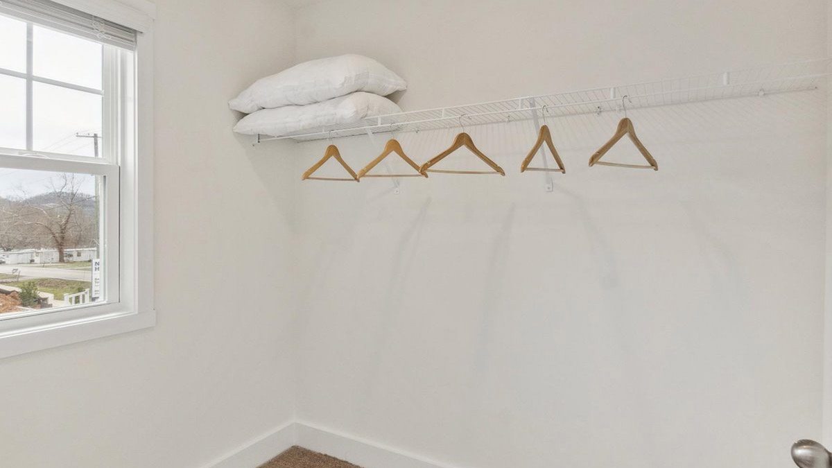 Primary walk-in closet with extra storage space