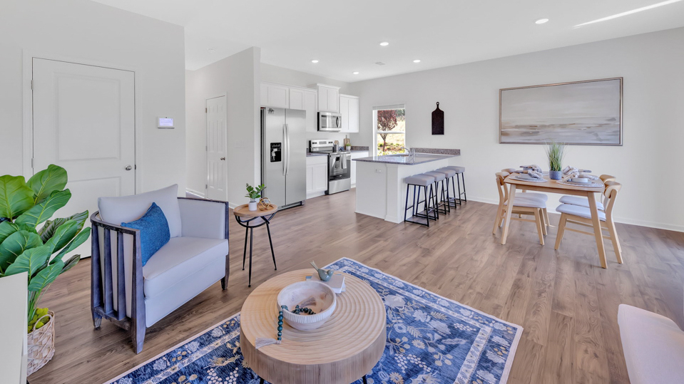 Open concept living, dining, and kitchen space