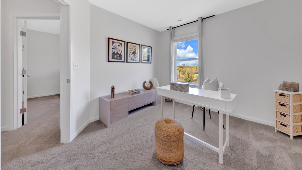 Bedroom with ample natural light and carpet floors