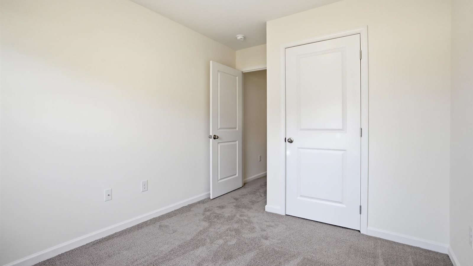 Bedroom with ample natural light and carpet floors