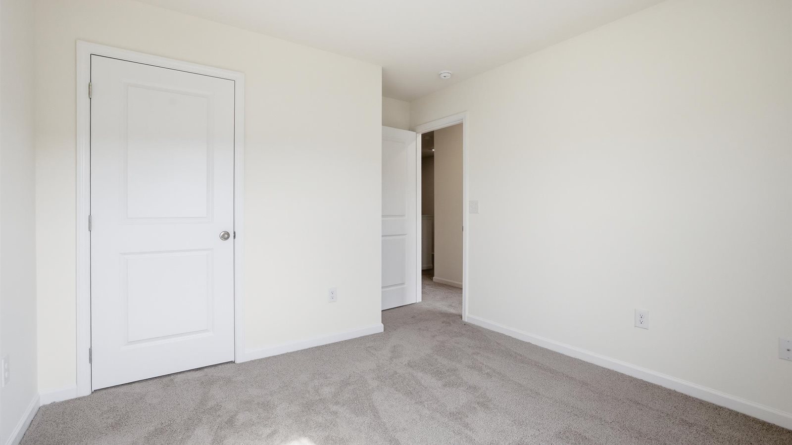 Bedroom with ample natural light and carpet floors