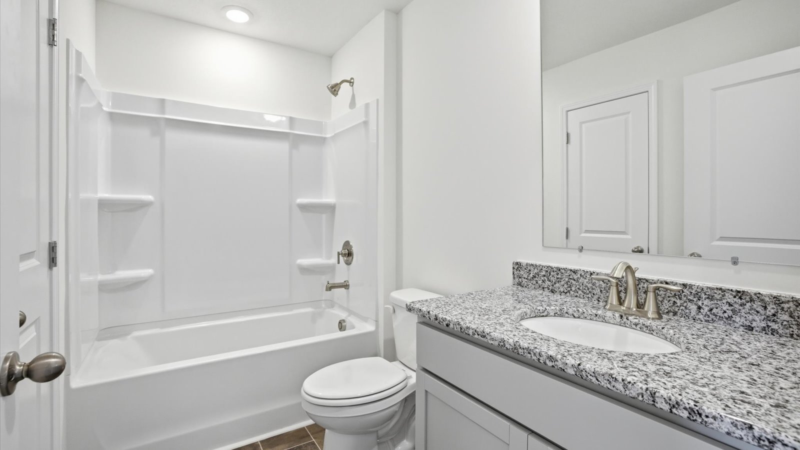 Upstairs bathroom with combination shower and bathtub