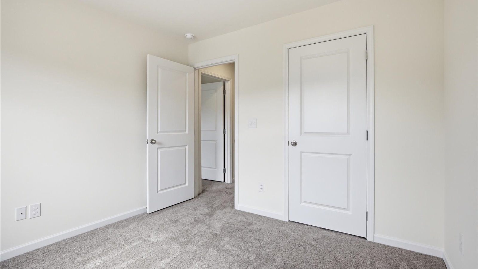 Bedroom with ample natural light and carpet floors