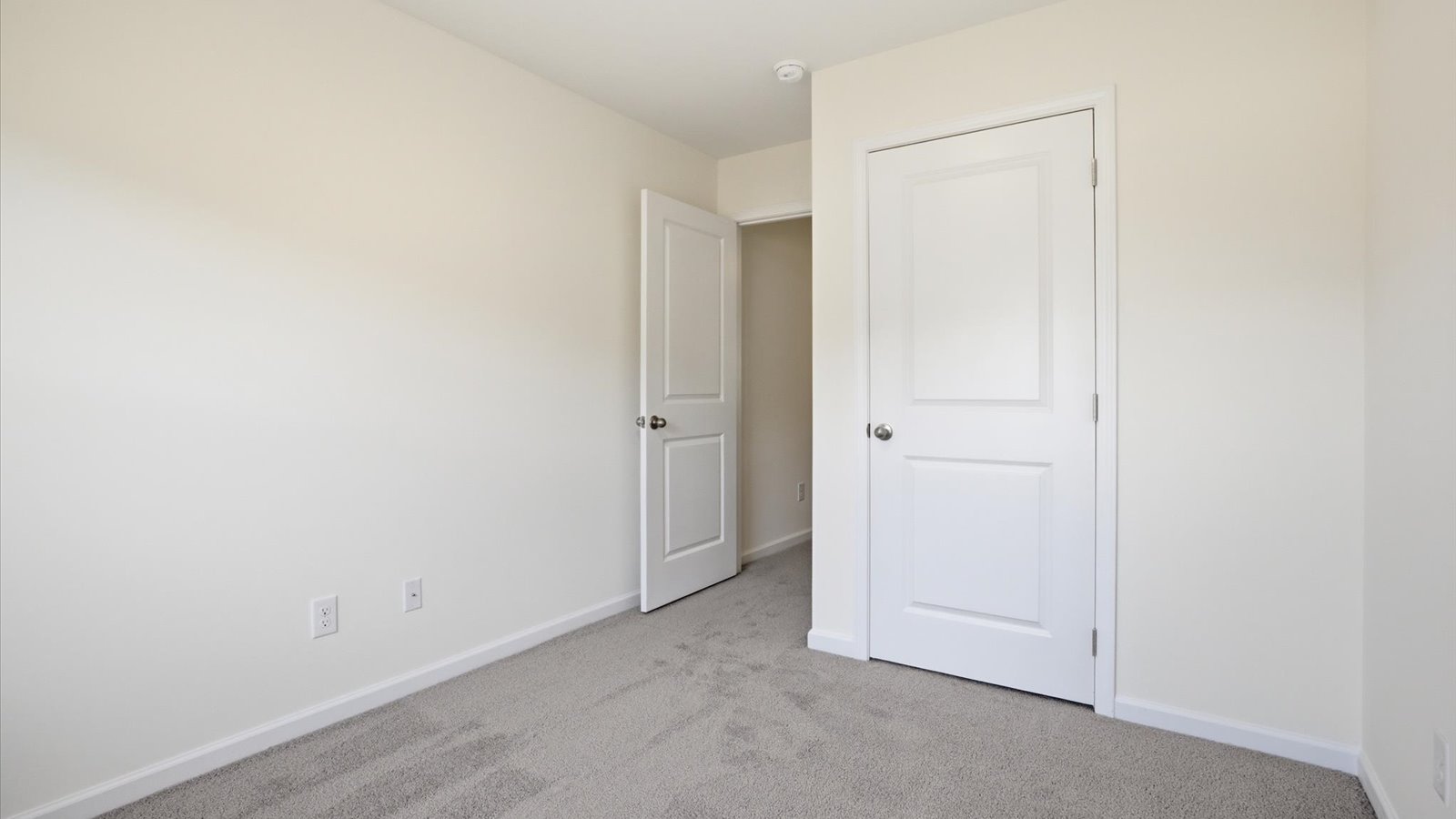 Bedroom with ample natural light and carpet floors