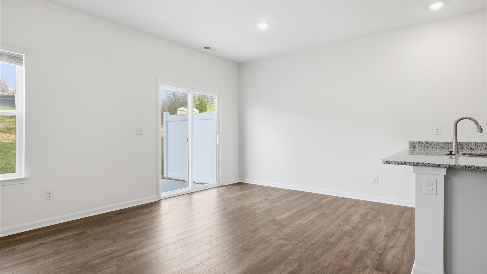 Open concept living, dining, and kitchen space