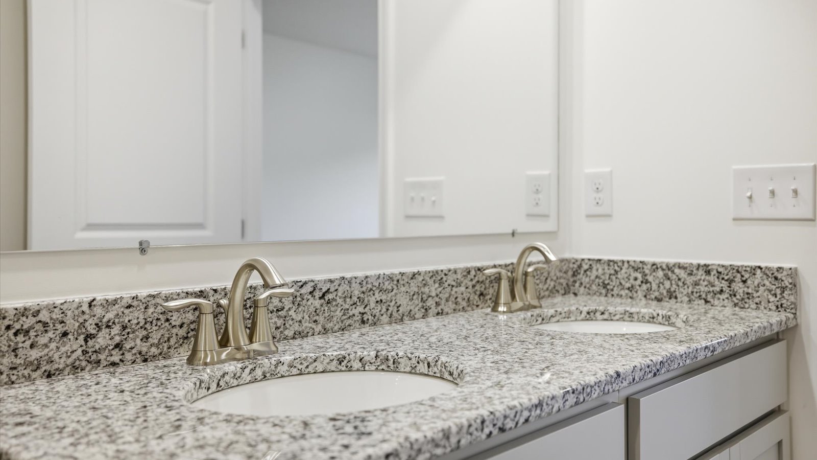 Private attached primary bathroom with built in vanity