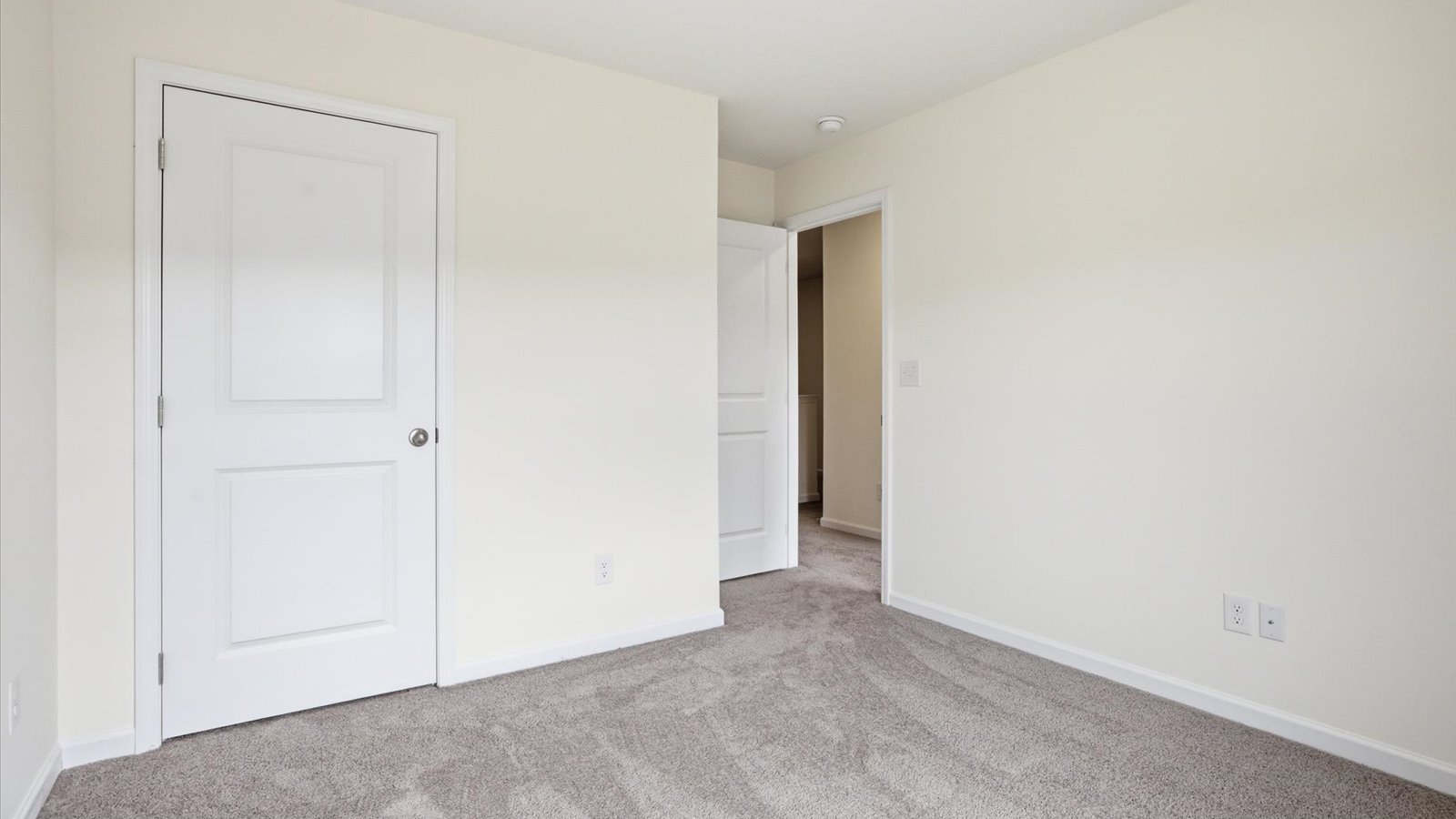 Bedroom with ample natural light and carpet floors