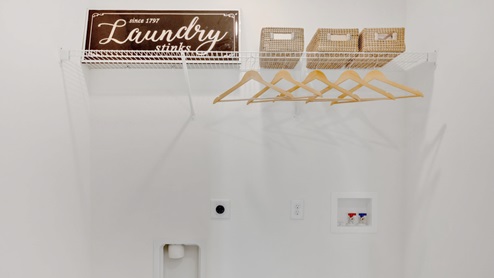 laundry room with wire shelves