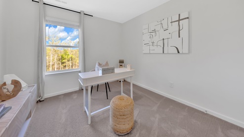 bedroom with white walls and carpet
