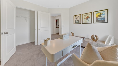 bedroom with white walls and carpet