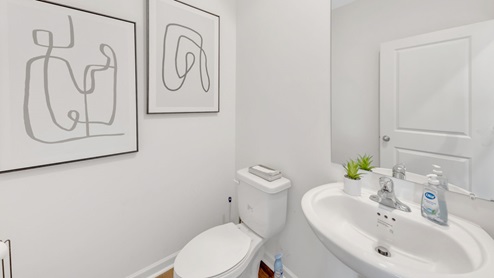 hall bathroom with white pedestal sink