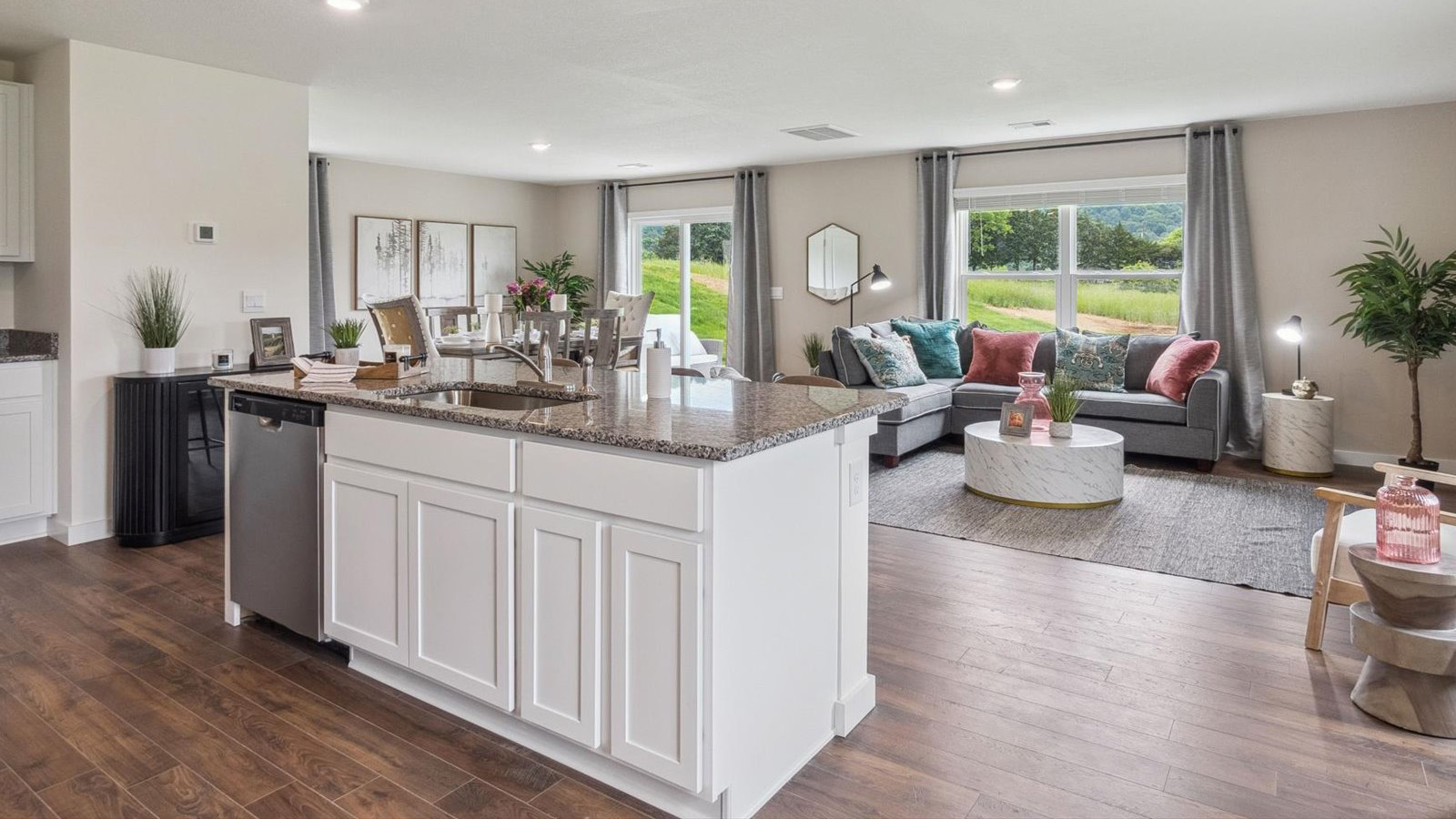 Open concept living, dining, and kitchen space