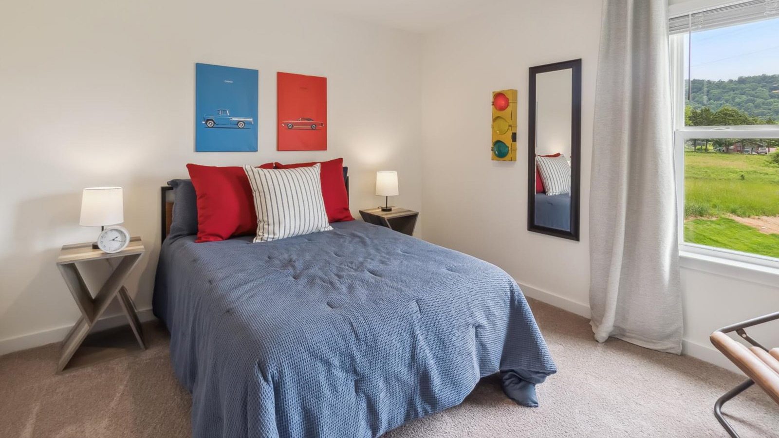 Guest bedroom 1 with front windows and ample natural light