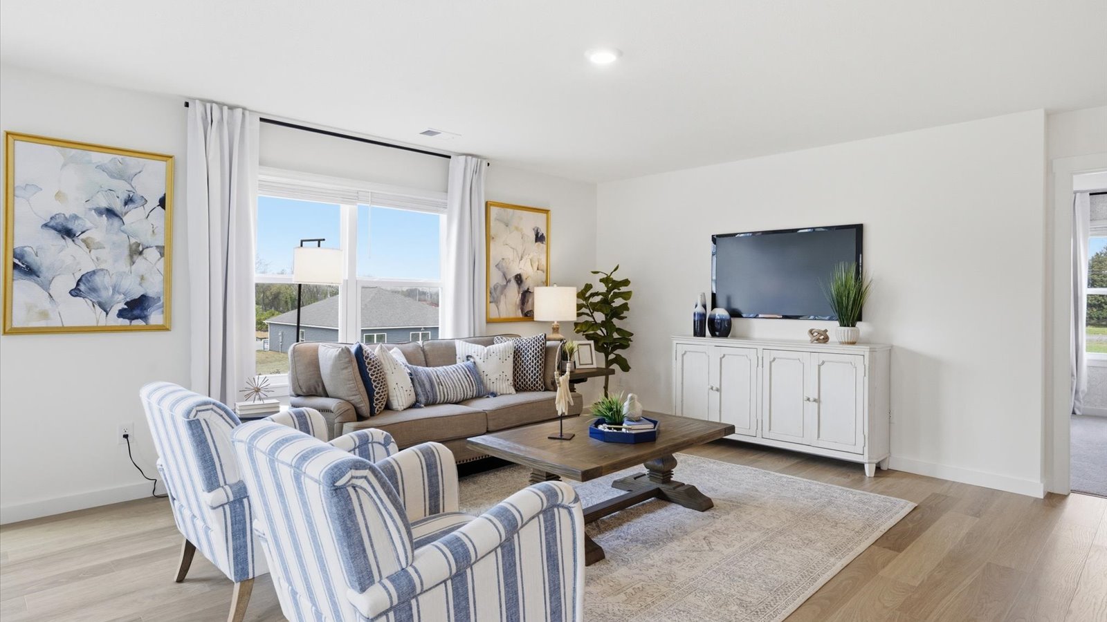 living area with large windows for ample natural light