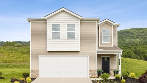 exterior with two car garage and brown vinyl siding