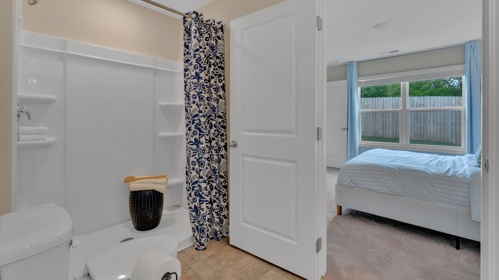 Primary bathroom with built in vanity and luxurious shower