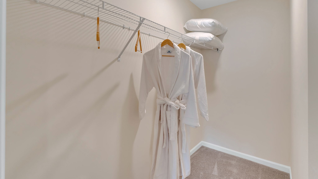 Primary walk-in closet with extra storage space