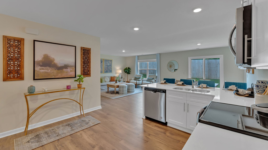 Open concept living, dining, and kitchen space