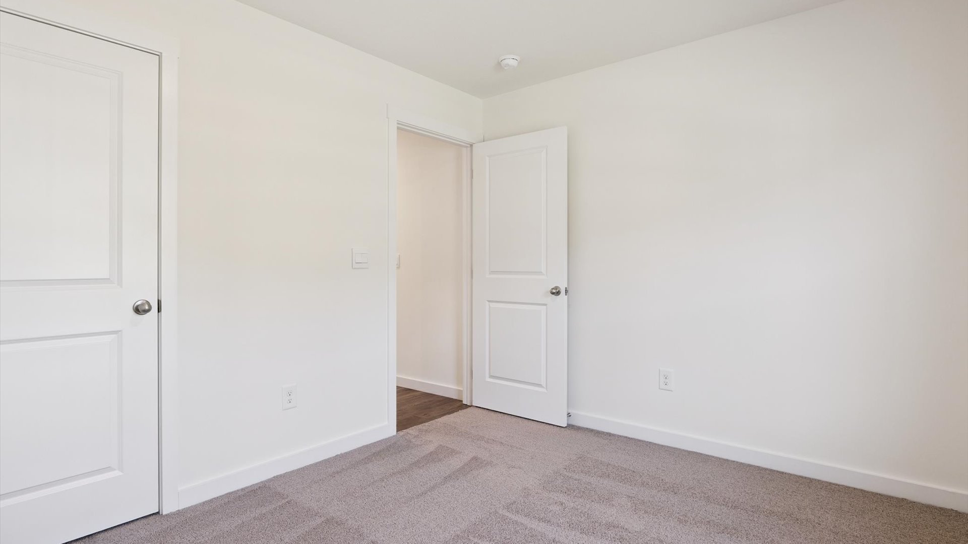 Third bedroom offers well-designed flexibility, ideal for sleeping space, a home office, or a fun game or hobby room