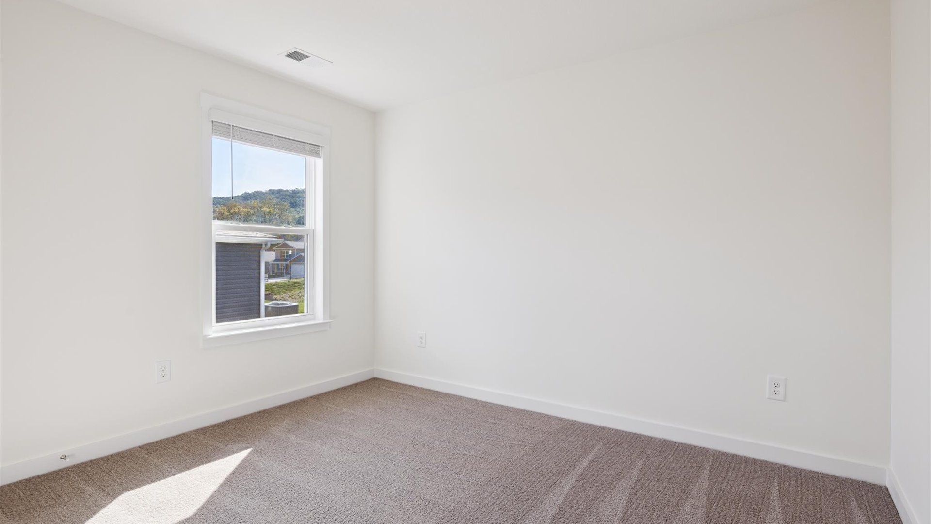 Owner’s suite offers natural window light, spa-inspired ensuite bathroom, backyard view, walk-in closet for everyday style