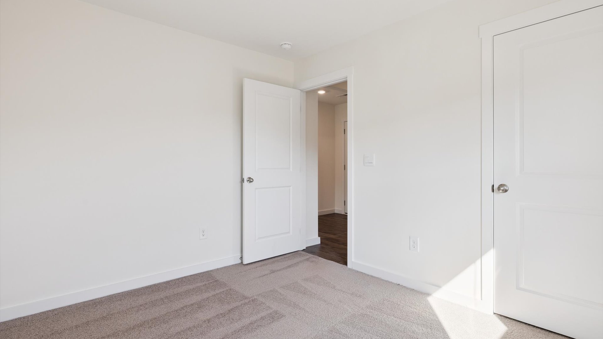 Primary bedroom designed with privacy and space in mind with a flow into a spa-inspired ensuite bathroom and walk-in closet