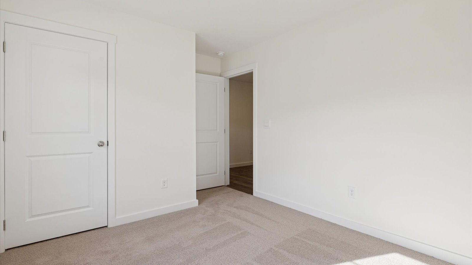 Bedroom with ample natural light and carpet floors