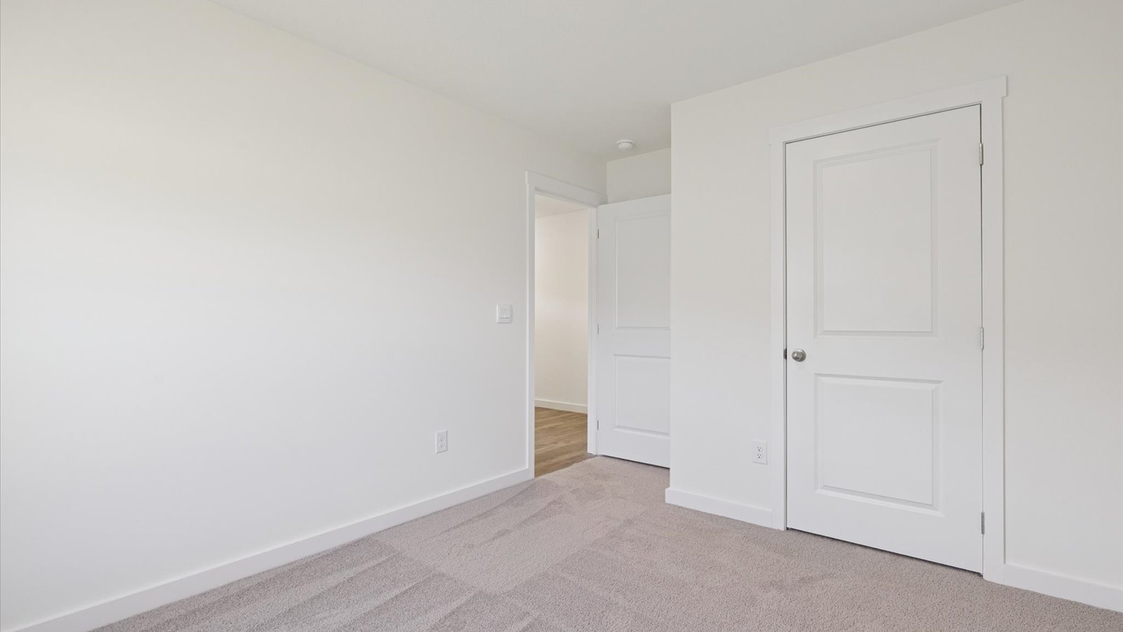 Bedroom with ample natural light and carpet floors