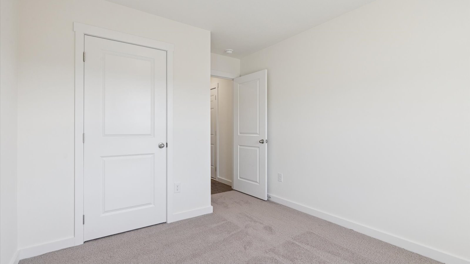 Bedroom with ample natural light and carpet floors