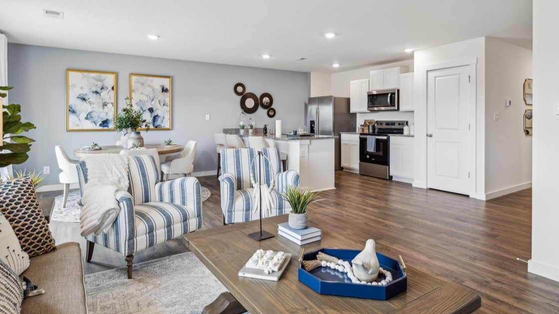 Open concept living, dining, and kitchen space