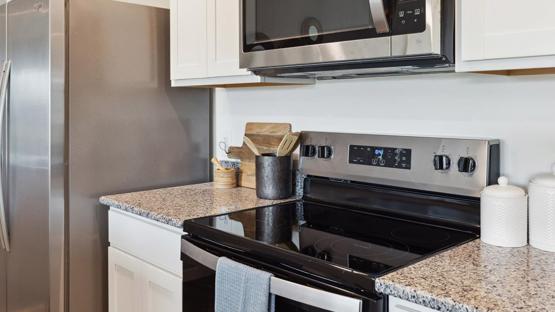 Open concept living, dining, and kitchen space